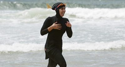 Trainee volunteer surf life saver Laalaa runs along North Cronulla Beach in Sydney